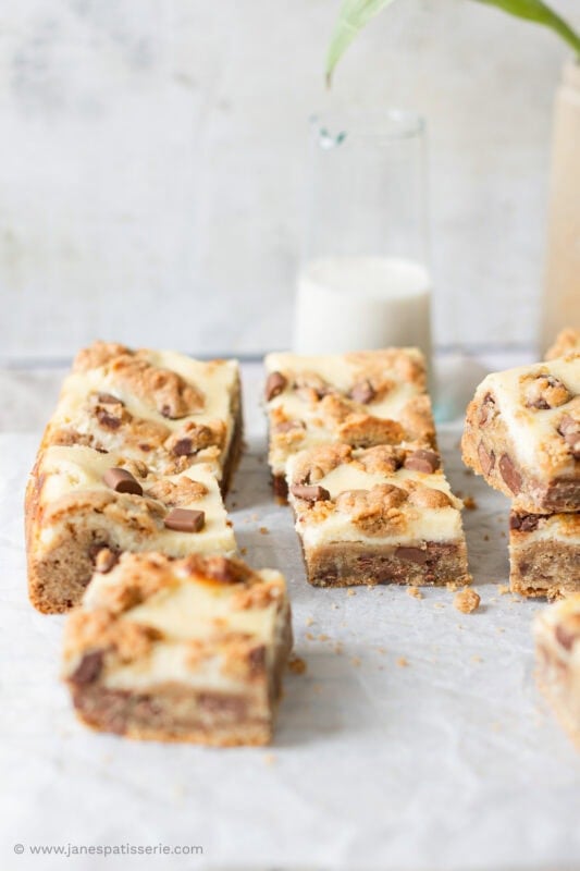 Multiple squares of Cheesecake Cookie Bars in a line