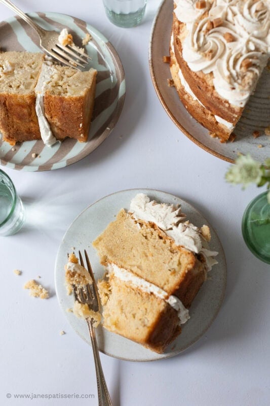 Two slices of apple crumble cake removed from the cake