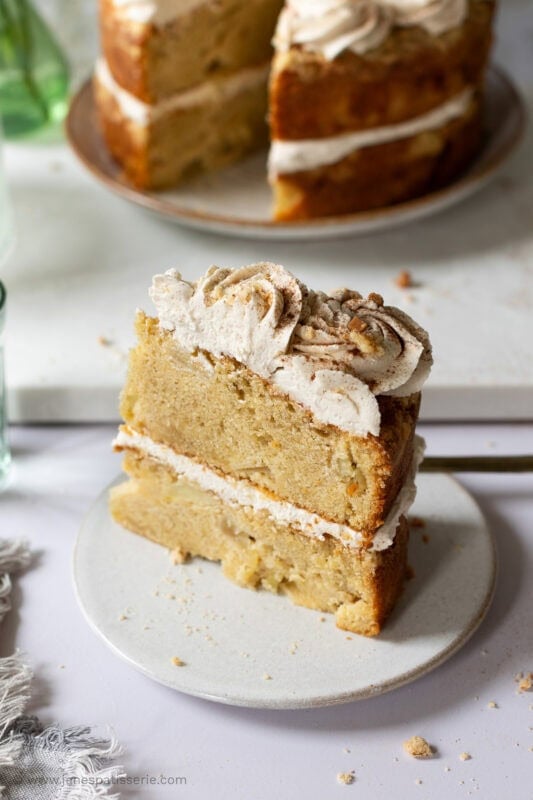 A slice of frosted apple crumble cake