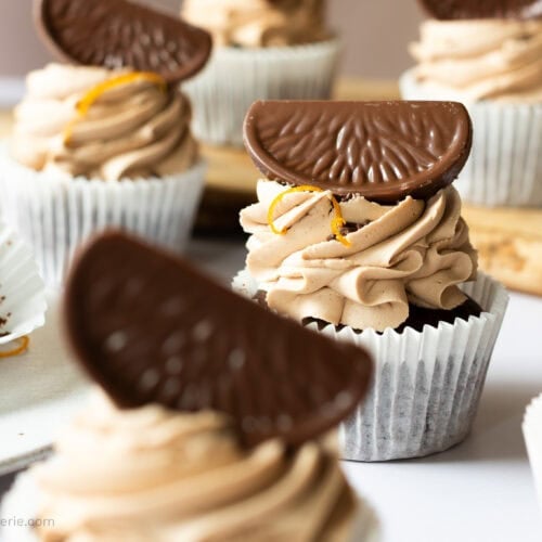 A row of Chocolate Orange Cupcakes with chocolate segments