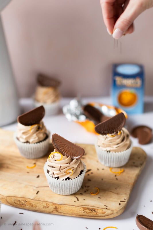 A selection of Chocolate Orange Cupcakes on a chopping board