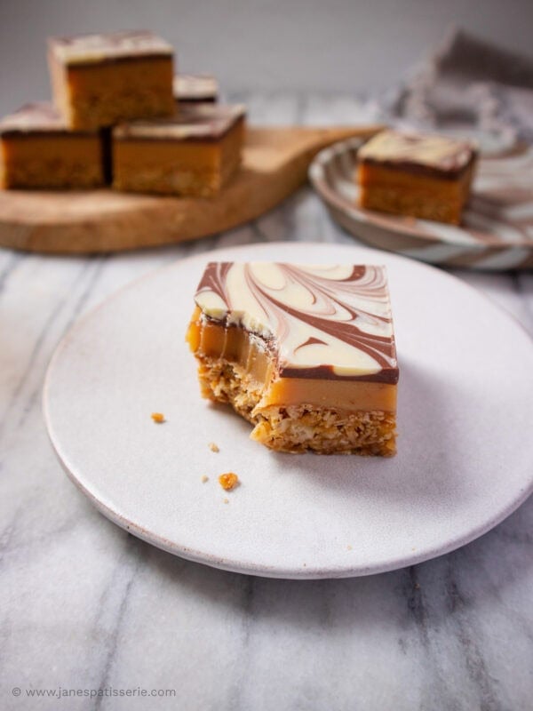 Millionaires Flapjack on a plate with a bite taken out of it