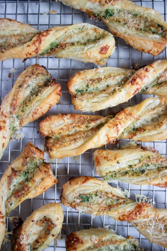 A row of Cheese Straws on a cooling rack