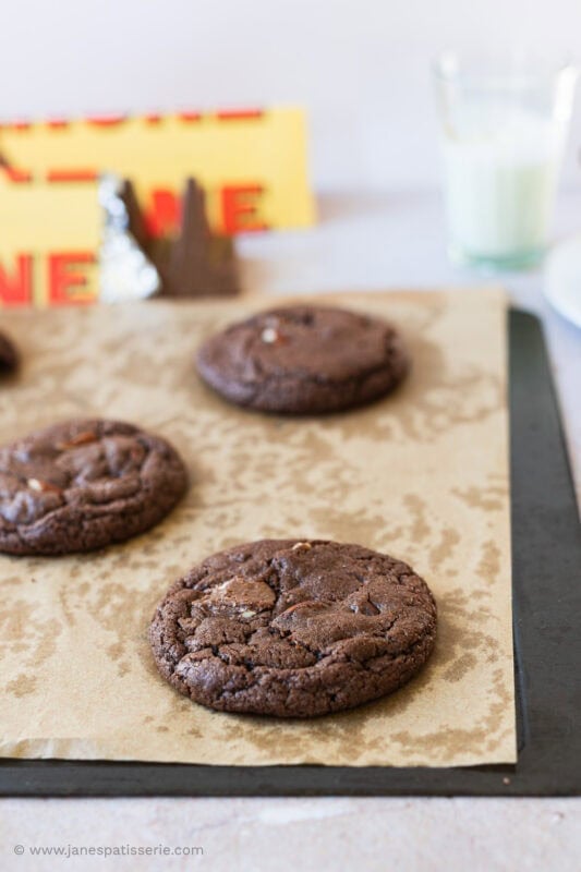 Three Toblerone cookies on a baking tray