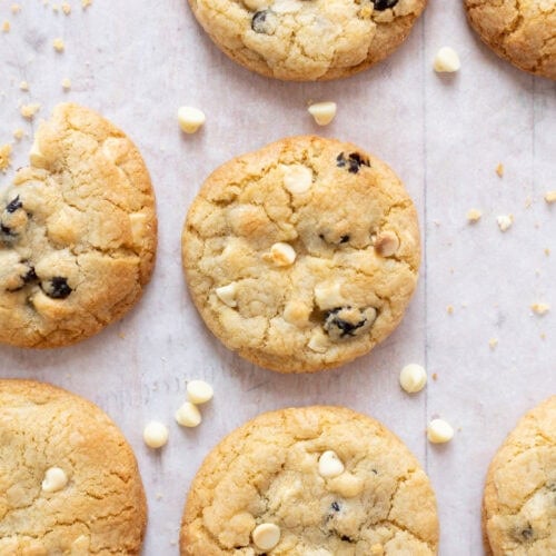 White chocolate and cranberry cookies on parchment paper