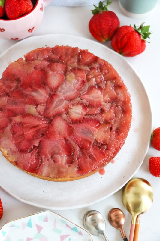 A strawberry upside down cake on a plate.