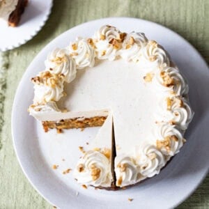 A slice into a carrot cake cheesecake