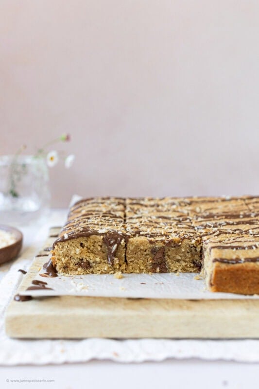 Slices of Coconut Chocolate Blondies missing from the traybake
