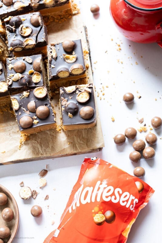 A bag of Maltesers with Malteser Millionaires Shortbread