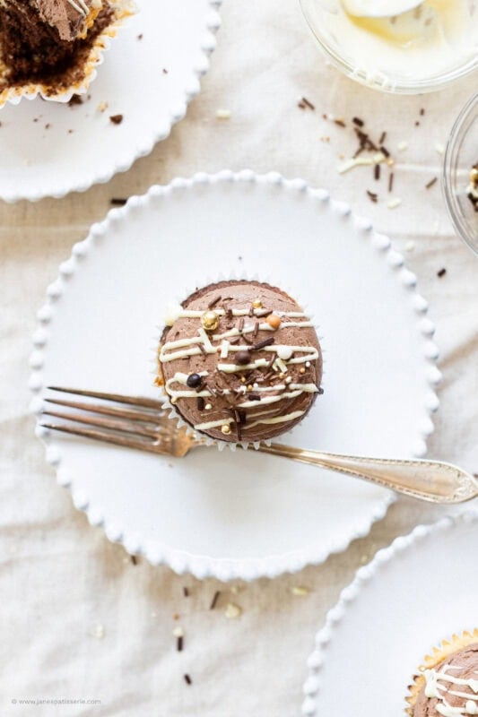 A marble cupcake on a plate with a fork