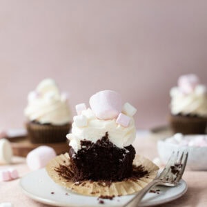 A bite taken from a marshmallow cupcake