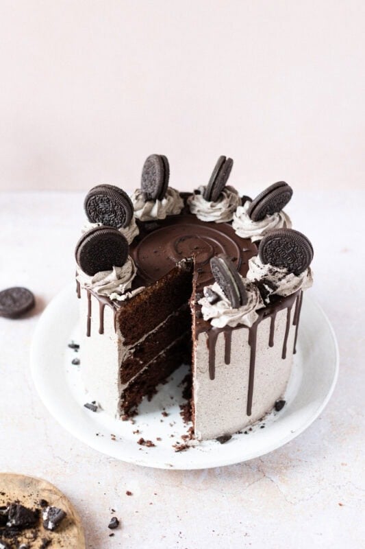 A slice taken from an Oreo Drip Cake
