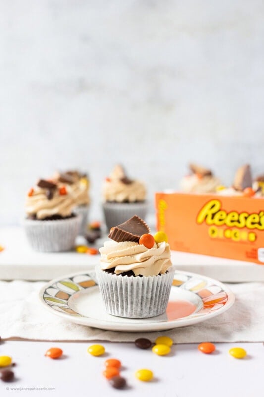 A Reese's Peanut Butter Cupcake on a plate