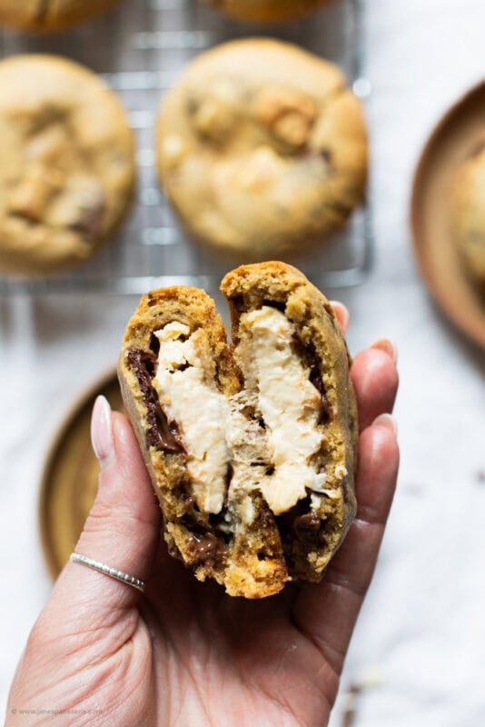 A hand showing a folded Salted Caramel Cheesecake Cookie