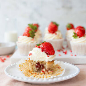 A bite taken from a Wimbledon Strawberry Cupcake