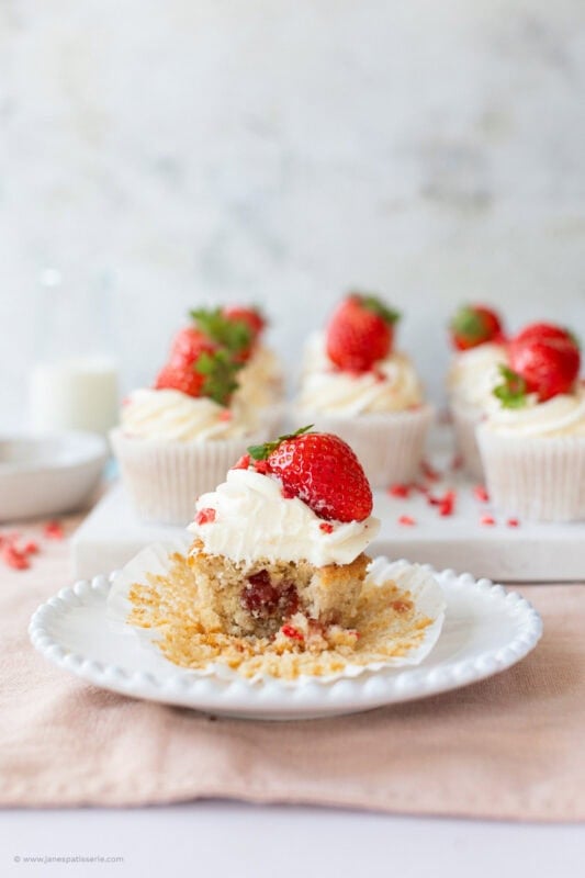 A bite taken from a Wimbledon Strawberry Cupcake