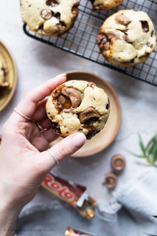 A hand holding a Rolo Cookie