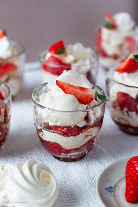 A close up of a single Eton Mess and homemade meringues.