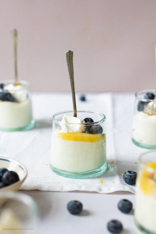 A single jar of Lemon Curd Mousse surrounded by other jars