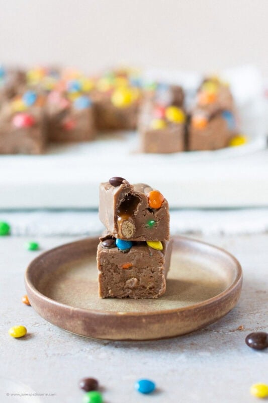 A stack of two slices of microwave fudge on a plate