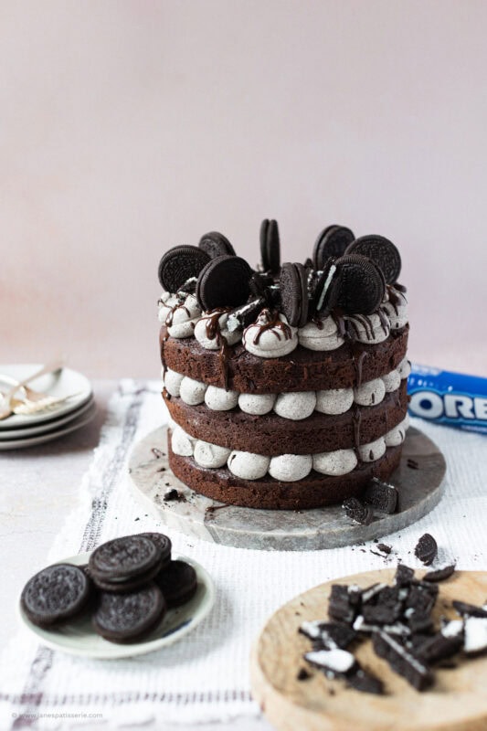 A whole Oreo Cake surrounded by Oreos