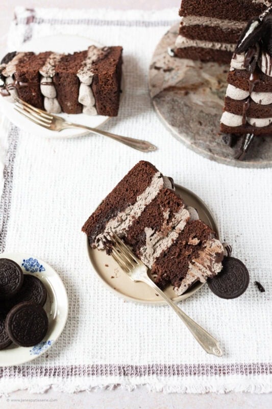 A bite taken from a slice of Oreo Cake