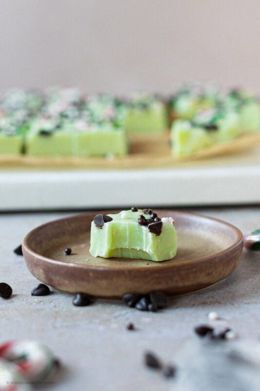 A bite missing from a slice of Peppermint Fudge