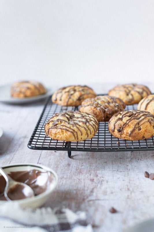 A cooling rack of freshly made coconut chocolate rocks