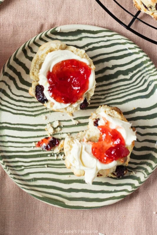 A bite taken from a White Chocolate and Cranberry Scone