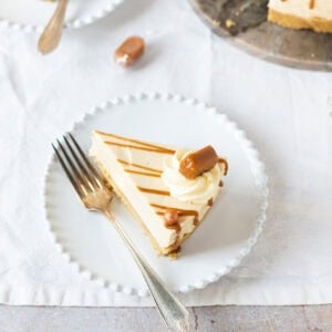 A slice of Butterscotch cheesecake on a white plate