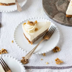 A fork and a slice of Banana Bread Cheesecake on a plate