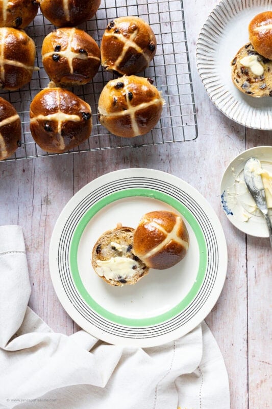 A hot cross bun on a plate
