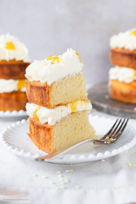 A bite taken from a slice of Lemon Celebration Cake