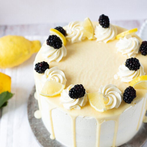 A finished Lemon Elderflower Cake on a serving board