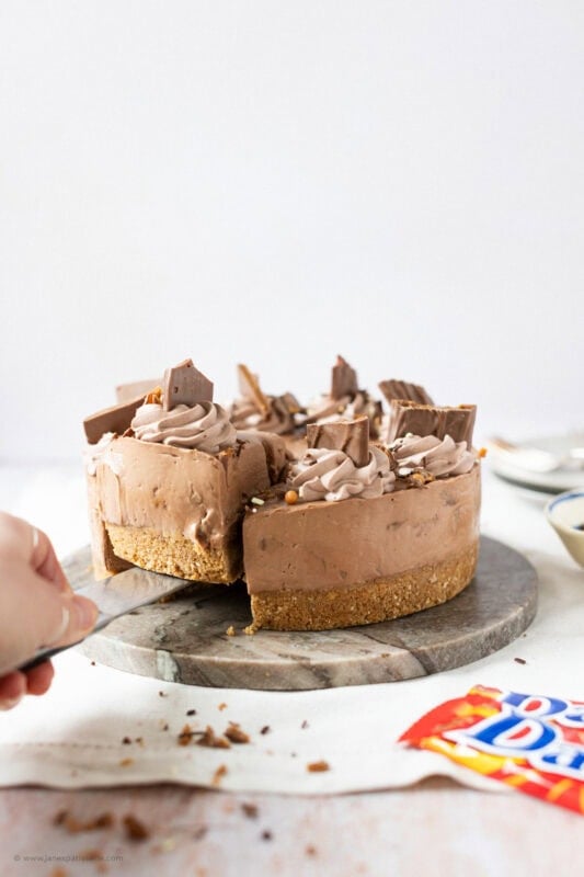 A slice cut into a No-bake Daim Cheesecake