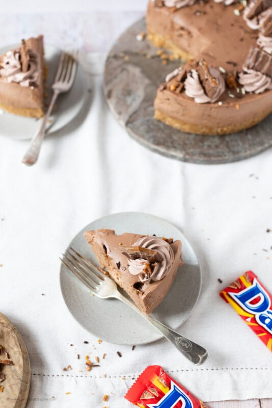 A slice of No-bake Daim Cheesecake on a plate