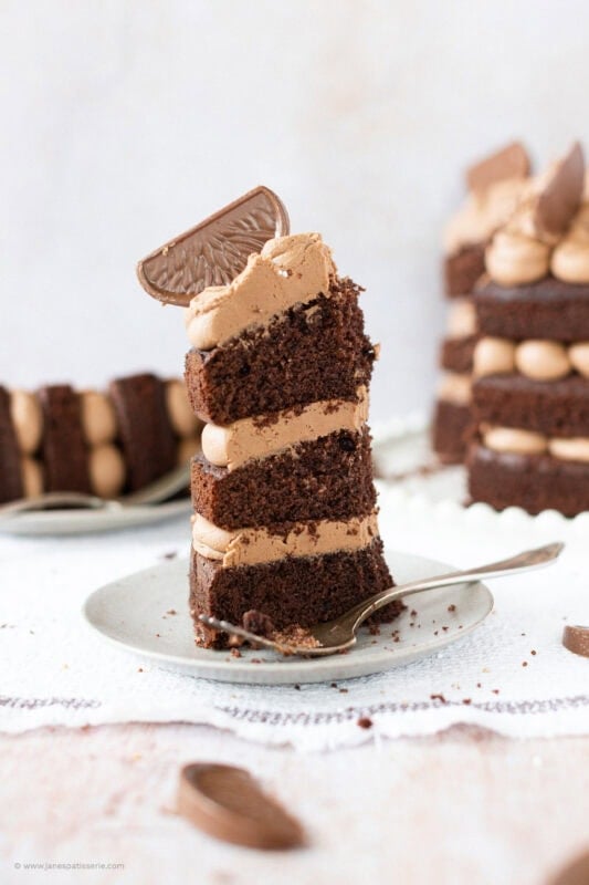 A bite missing from a slice of Terrys chocolate orange cake