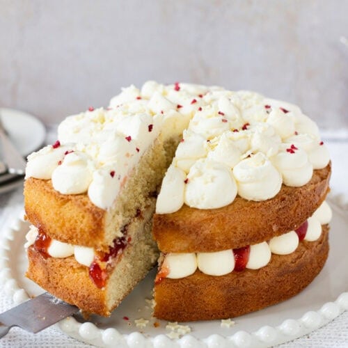 A slice being cut into a Vanilla Cake - back to basics